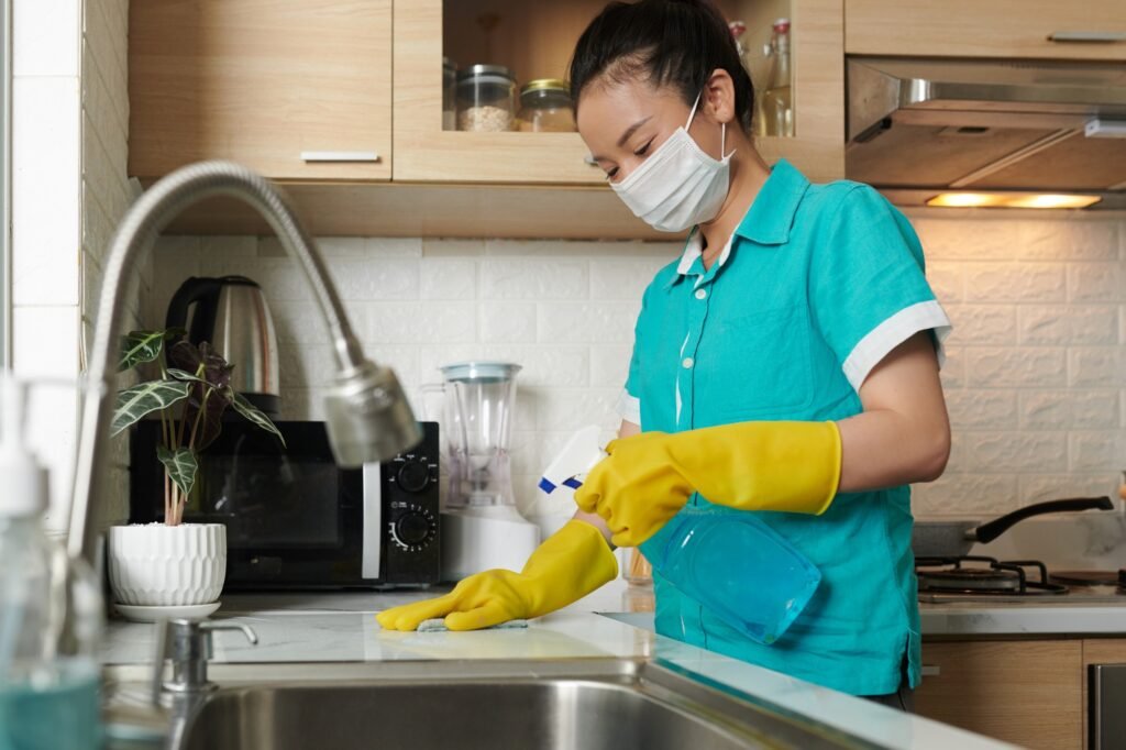 Cleaner disinfecting sink in kitchen